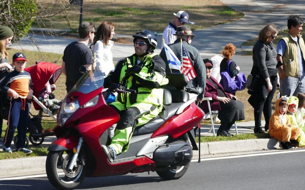 Motorcycles at the annual Toco Hills Purim Parade are a bit more controlled and a lot more road-ready than a dirt bike decades ago.