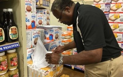 Photo by Leah R. Harrison
Moses Bester is checking the Passover inventory list twice at the Kroger at the Toco Hill Shopping Center.