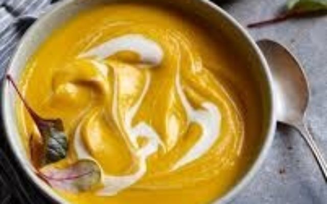 A swirl of sour cream or Greek yogurt enhances Carrot, Orange and Fennel Soup at a dairy meal.