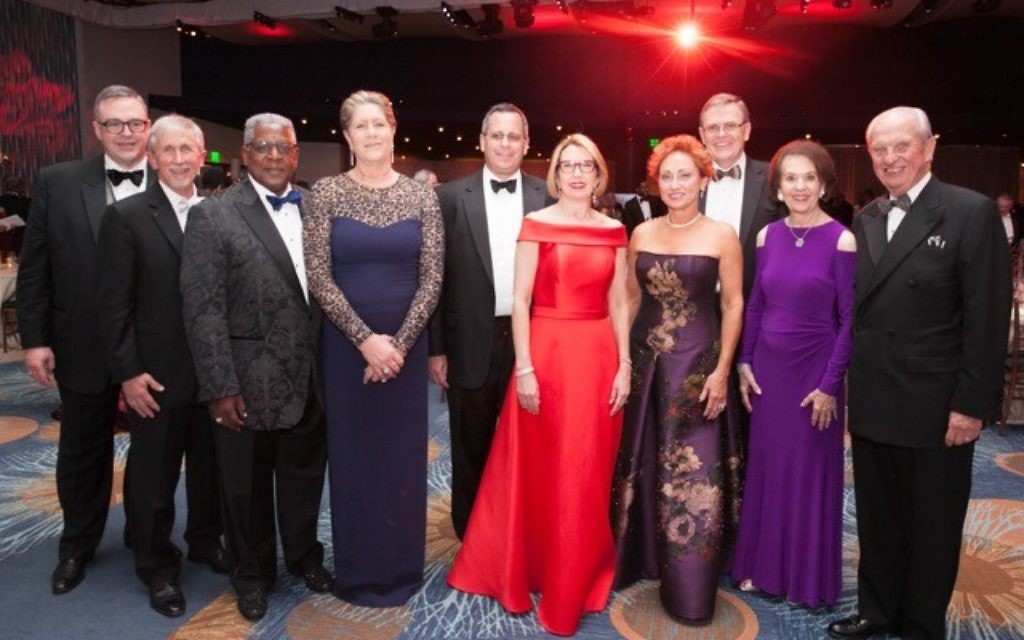 Attending the White Coat Grady Gala are (from left) Grady President and CEO John Haupert, Bryan Brooks, Eddie and Jan Meyers, Ned and Renay Blumenthal, Sherry and David Abney, and Ada Lee and Pete Correll.