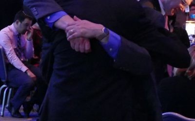 Rabbis Alvin Sugarman and Joshua Heller share a hug after Rabbi Sugarman’s speech accepting MACoM’s recognition March 16.