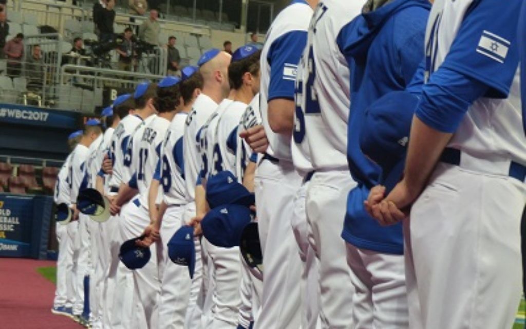 Team Israel wears blue kippot during the playing of "Hatikva" earlier in the World Baseball Classic.