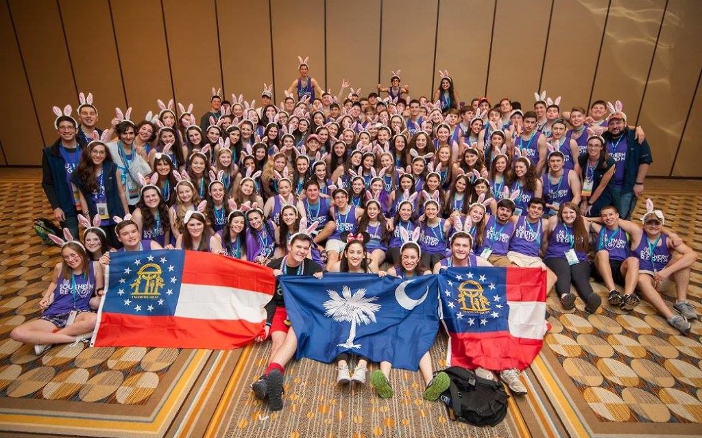 Members of Atlanta Council and other parts of BBYO’s Southern Region sport bunny ears, representative of Southern Region mascot Bugs Bunny, during a group photo at the BBYO International Convention.