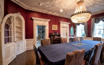 The dining room has ample room for entertaining, although the chandelier is a 1920s-era replacement from Morningside because the original was stolen while the house was on the market.