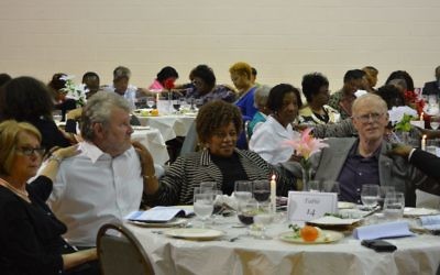 Members of Temple Emanu-El and Greater Piney Grove Baptist Church share a mid-Passover seder in the Old 4th Ward. (Photo by Merical Alexander)
