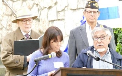 Ben Walker and daughter Ronit Walker present a Yiddish reading in front Harold Kirtz and Robert Max at the 2017 Yom HaShoah observance at the Memorial to the Six Million at Greenwood Cemetery.