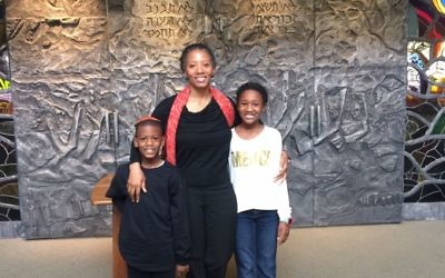Tarece Johnson attends Temple Sinai with children Hannah and Nile.