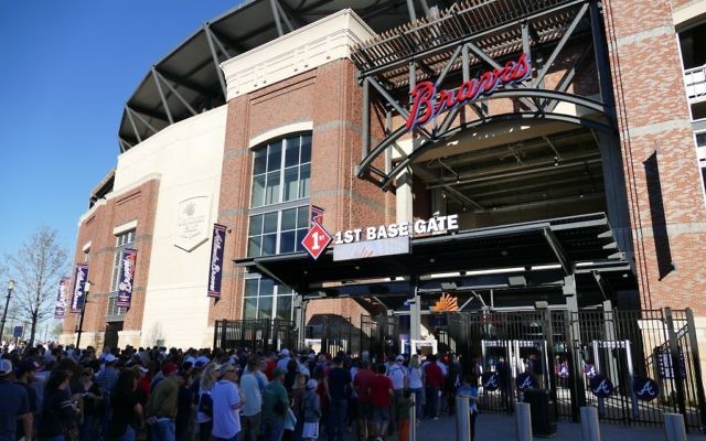 Long security lines await fans at the Atlanta Braves’ first game inside their new stadium on March 31.