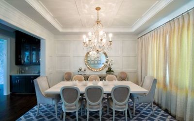 A Dennis & Leen chandelier from Jerry Pair meets the need for lighting that contributes to a calm, clean look throughout. The dining table and chairs are by Bradley USA.