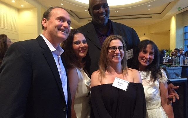 Israeli basketball legend Lavon Mercer, an IDF veteran, stands behind and towers over (from left) recent congressional candidate Ron Slotin, Eti Lazarian, Sloane Barras and Felicia Voloschin at an FIDF event in May 2017.