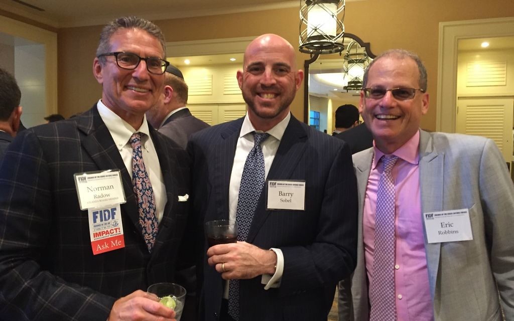Joined by Barry Sobel (center) and Jewish Federation of Greater Atlanta President and CEO Eric Robbins (right) at the FIDF gala, Norman Radow says, “Of all my charitable contributions, the FIDF scholarship fund is the most impactful in terms of effecting lives.”