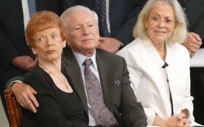 Holocaust survivors Eva and Robert Ratonyi and Israeli Consul General Judith Varnai Shorer, the daughter of survivors, listen to the Atlanta Young Singers of Callanwolde sing “Eli Eli” at the 2017 Georgia Commission on the Holocaust Days of Remembrance ceremony.
