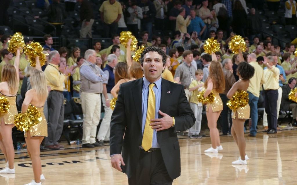Businesses can learn from Josh Pastner, shown enjoying the atmosphere of Georgia Tech’s final regular-season home game Feb. 28. (Photo by David R. Cohen)
