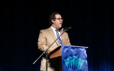 Rabbi Micah Lapidus, shown delivering the invocation to the Class of 2017 at the Davis Academy, is a man of music throughout the year.