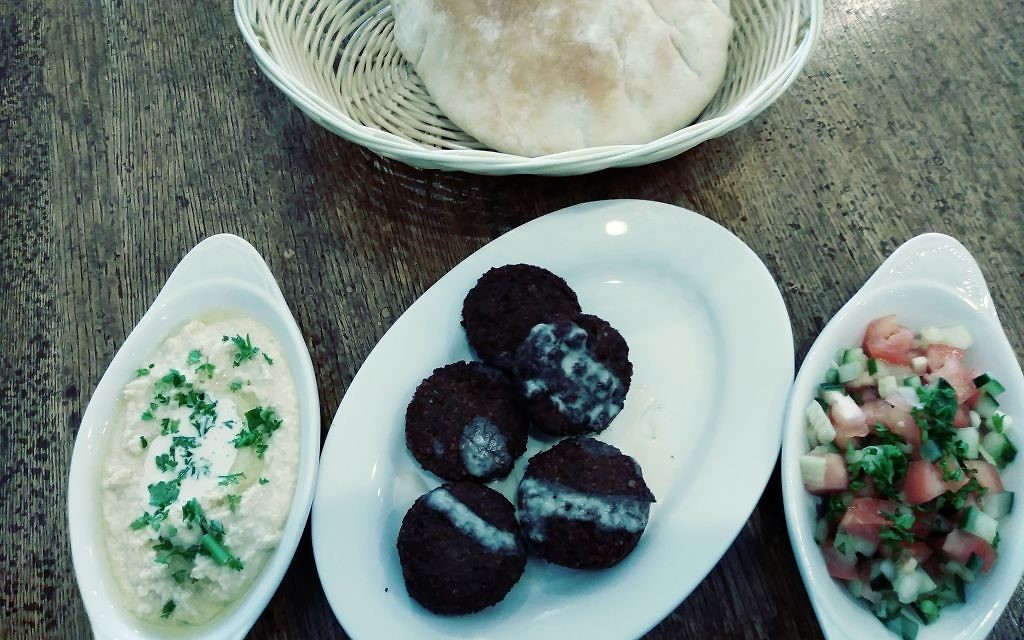 Israeli favorites at Cafe Bello include falafel, hummus, Israeli salad and pita bread.