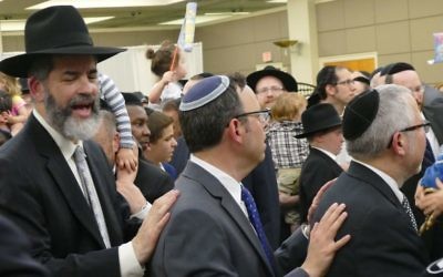 Many local rabbis, such as Young Israel’s Adam Starr, join Rabbi Ilan Feldman in the celebration.
