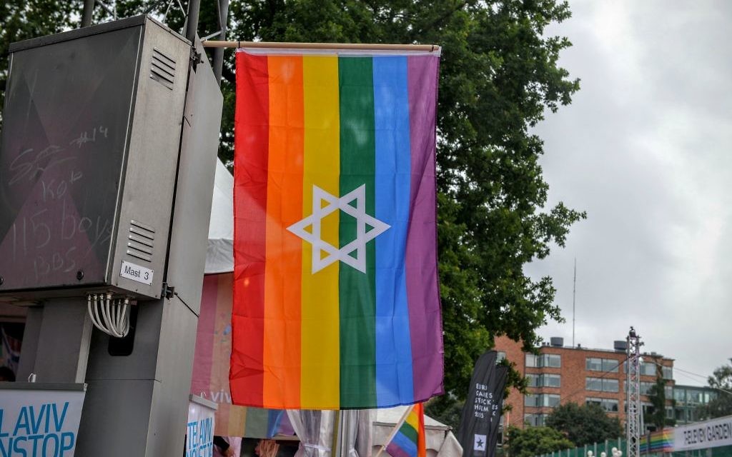 Jewish pride flags, like this one displayed at the Stockholm Pride Parade in July 2015, proved unacceptable at the anti-Zionist Chicago Dyke March in June. (Photo by Jonatan Svensson Glad // CC-BY-SA 4.0 // via Wikimedia Commons)
