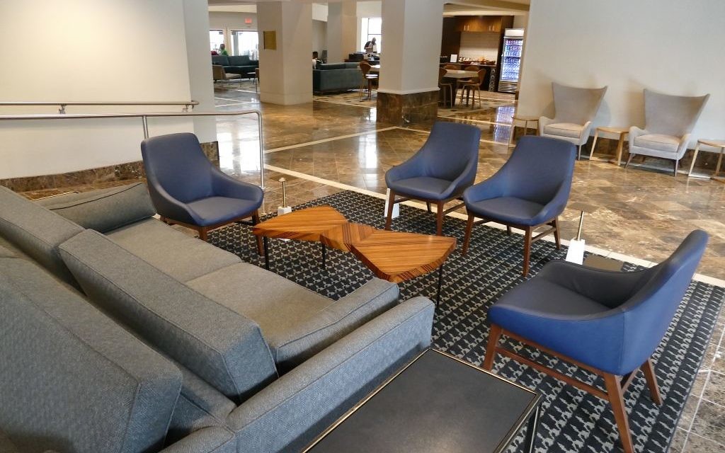 The DoubleTree hotel in downtown Atlanta is in the final stages of retro renovations to honor Dr. Marvin Goldstein who opened the Americana Motor Hotel in 1962, downtown's first integrated hotel. The hotel lobby features midcentury modern furniture.