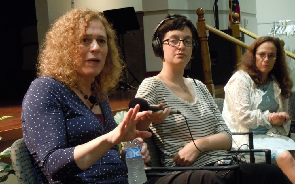 Joy Ladin (left) speaks during her appearance at the Selig Center on Aug. 17. Rebecca Stapel-Wax (right), the executive director of event sponsor SOJOURN, listens.