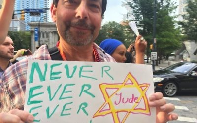 Perry Goodfriend, son of Holocaust survivor Cantor Isaac Goodfriend, attends an Atlanta march in solidarity with Charlottesville and the anti-Nazi demonstrators Saturday, Aug. 12, which marked his father’s yahrzeit. (Photo by Audrey Galex)