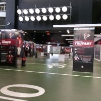 The 100 Yard Club on the stadium's upper level boasts 100 yards of bars, concessions and Falcons themed displays. It is the most heavily Falcons themed area in the entire stadium.