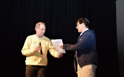 Art Link presents an Enlighten America certificate of achievement to essay contest winner Gabe Weiss of Atlanta Jewish Academy in February 2017. (Photo by Barrie Cohn)