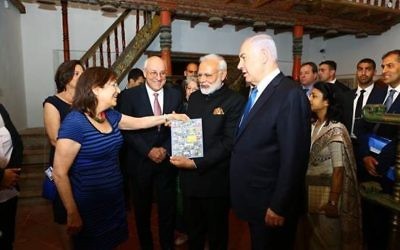 Photo by Avi Dodi
Marian Scheuer Sofaer presents a copy of “The Synagogues of India” to Indian Prime Minister Narendra Modi at the Israel Museum on July 5.