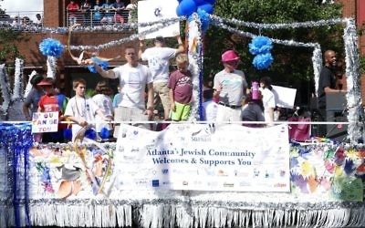 Hand cutouts highlight the Jewish community's float in the Atlanta Pride Parade on Oct. 15.