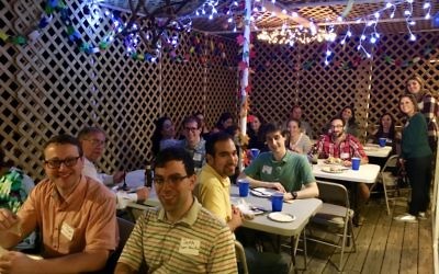 The Levy family sukkah is all fun and games for The Sixth Point’s young-professional crowd.