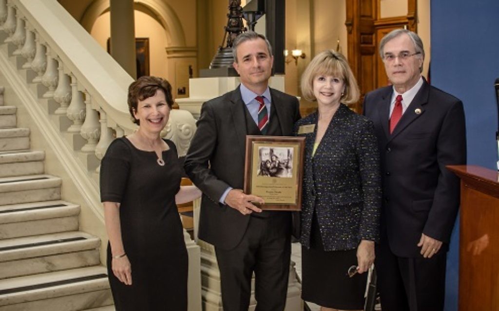Brendan Murphy (second from left), shown accepting the Georgia Commission on the Holocaust's Educator of the Year award for the second time in May 2016, added the ADL's Abe Goldstein Award to his honors Nov. 2.