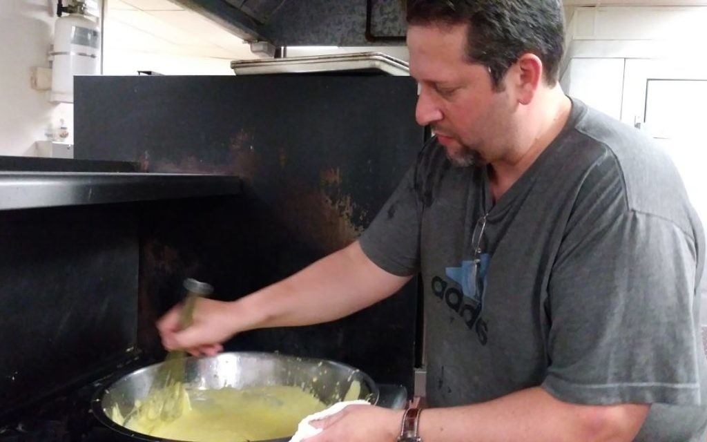 Chef Mark Hennessey whips up the hollandaise sauce.