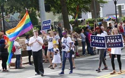 Mayoral candidate Peter Aman and supporters participate in the Atlanta Pride Parade on Sunday, Oct. 15.
