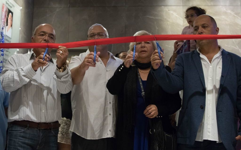 (From left) Ron Manoah, Moshe Manoah, Rivka Manoah and Avi Manoah cut a ribbon marking the grand opening of the Chabad Israeli Center Atlanta. - Photos by Nofar Avigal