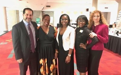 JF&CS Chief Executive Officer Rick Aranson and Chief Program Officer Faye Dresner (right) join MiMi Mondesir (second from left) and her daughters at the Numbers Too Big to Ignore award ceremony.