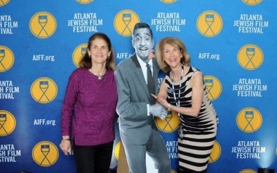 Susan Caller (left) and Marcia Caller Jaffe have fun with Sammy Davis Jr. on the red carpet, where Button It Up took and distributed free photos of gala attendees.