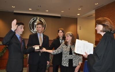 Joseph Goldstein takes the Marietta City Council oath of office Dec. 18, administered by Senior Superior Court Judge Adele Grubbs. Holding the Tanakh are his father, outgoing council member Philip Goldstein; his brother, David Goldstein; and his mother, Elise Goldstein.