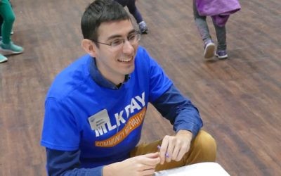 PJ Library’s Nathan Brodsky provides guidance at one of the card-making tables.