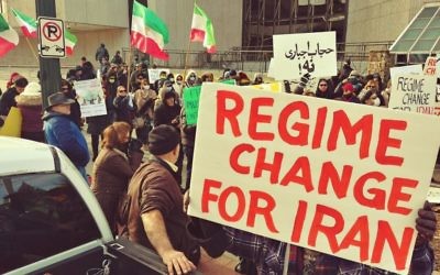 Iranian-Americans gather in front of the CNN Center on Sunday, Jan. 7, to show solidarity with protesters in Iran.
