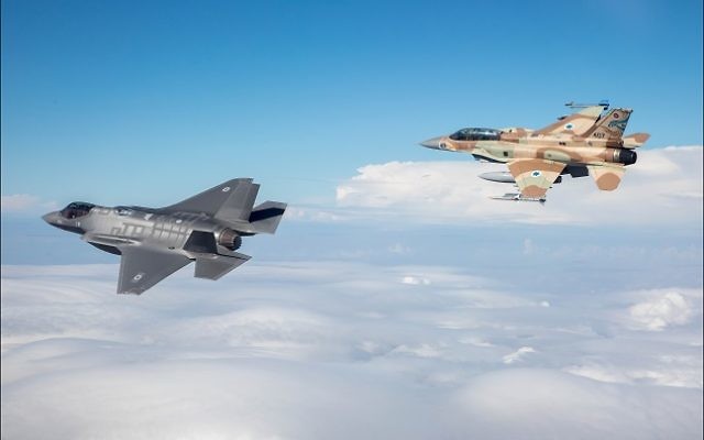 An F-16I Sufa fighter-bomber (right), like the one shot down Saturday, Feb. 10, flies near Israel’s first F-35 Adir in December 2016. Lockheed Martin produces both aircraft. (Israeli Air Force photo)
