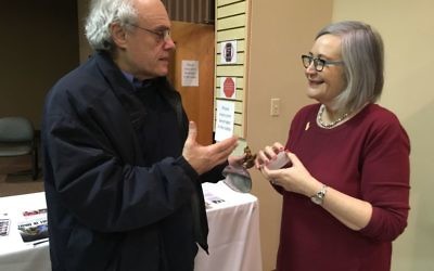 Ken Stein speaks with Lesley Sachs about equal rights and gender equality after the presentation, during which he noted that “Hatikvah” calls for a free people in our land, not free men in our land.