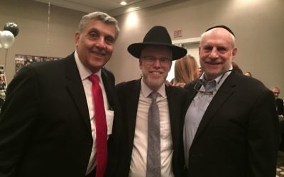 Chuck Lowenstein, Rabbi Shimon Wiggins and Harve Linder pose at the kollel celebration. (Photo by Marcia Caller Jaffe)