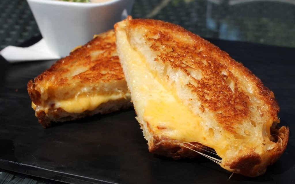 Two kinds of cheese enhance the crispy goodness of the grilled cheese sandwich at Three Sheets.