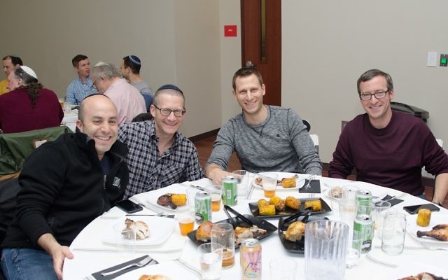 (From left) Edan Shapiro, Joey Wilson, Dave Katzman and Joel Avrunin are ready for the first course at the Man Seder. (Photo by Eli Gray)