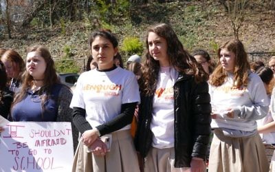 Students stand in solidarity with the national walkout Wednesday, March 14, to call for changes on guns and school security.