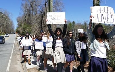 Students march in Sandy Springs as part of the national walkout.