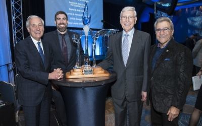 Bernie Marcus accepts the Visionary Award from the leadership of Hillels of Georgia — Rabbi Russ Shulkes, the executive director, and Michael Coles, the board president — and Hillel International President Eric Fingerhut (left).