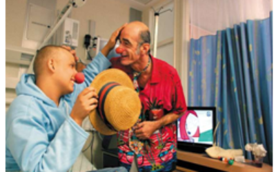 Chris, one of Hadassah's medical clowns, plays with a patient in the pediatric oncology department at Hadassah Ein Kerem.