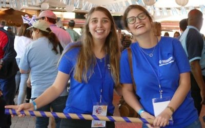Or Shaham (left) and Lior Bar, Atlanta’s first shinshinim through a Jewish Agency program, combine work and play at the community celebration.