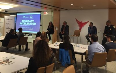 Wellspring Living’s Sarah Richardson speaks about human trafficking during the ACCESS/Black-Jewish Coalition’s Advocacy Accelerator event April 23, while Bob Rodgers, Judge Eric Richardson and Deputy Chief Vance Williams listen.