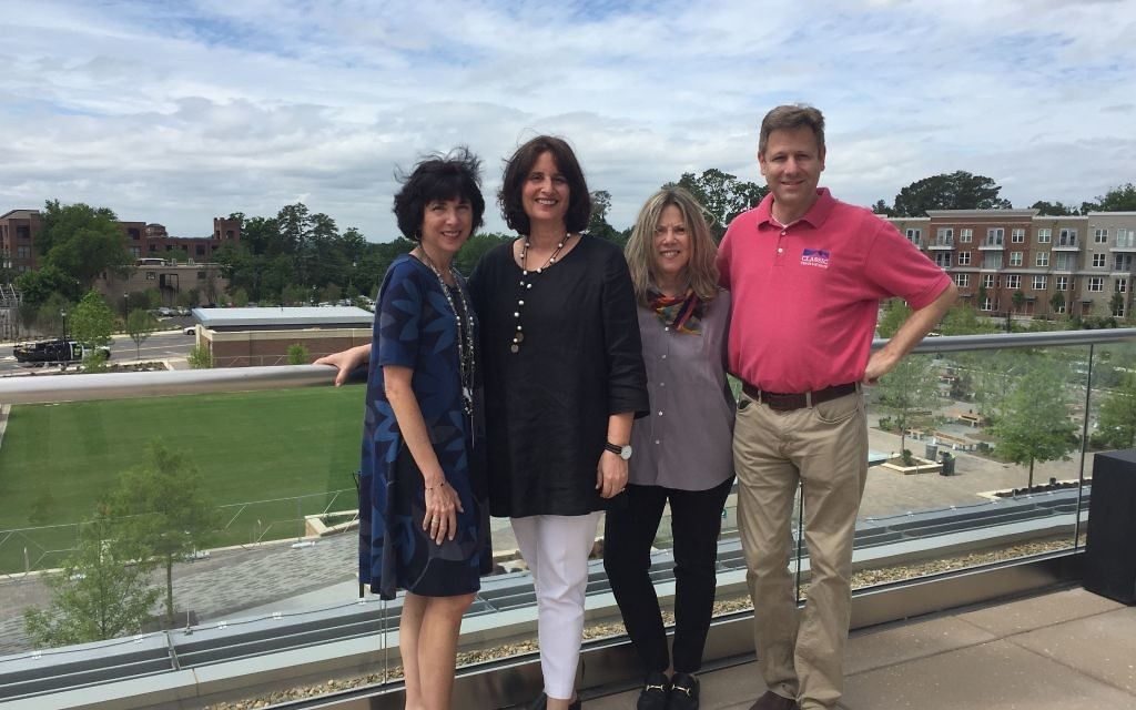 (From left) Sandy Springs spokeswoman Sharon Kraun, Taste of Atlanta CEO Dale Gordon DeSena, Marla Shavin of City Springs and Steven Eisenstein of Classic Tents line up over the grounds where Food That Rocks will be held June 9. (Photo by Marcia Caller Jaffe)